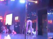 Two Hot Brunettes Dancing Around A Pole In Thong