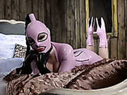 Latex Nympho In High Heels Fingers Her Shaved Pussy On The Wide Bed