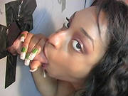 Ebony-skinned Babe With An Awesome Body Sucking A Big White Cock Through A Glory Hole