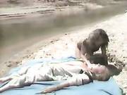 Tanned Vintage Babe Gives Eager Blowjob On A Beach