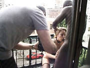 Horny Chick In Stockings Gives Eager Blowjob On A Balcony