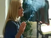 Horny Blonde Enjoys Smoking While Posing