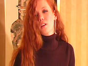 Sexy Redhead Poses In Pantyhose