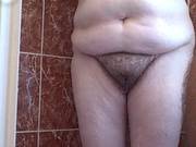 Сlose Up Of Her Hairy Pussy As She Dryes Her Body.
