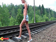 Doll In Bikini Is Walking Outdoors