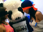 Two Blind Folded Chicks Touching Each Other At  Tacky Party