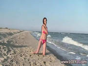 Babe In Red Swimsuit In The Sea