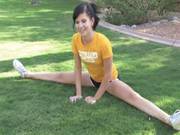She Is A Cheer Leader Stretching Out In The Garden 
