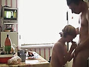 Blonde Girlfriend Making  Love With Her Boyfriend On A Kitchen