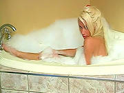 Alluring Blonde Is Taking Bath And Dressing