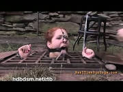 A Cute Redhead Slave Tortured Outside