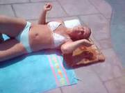 Donna Laying Out In Bikini