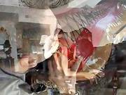 Collared Latex Whore Sucks A Large Rod