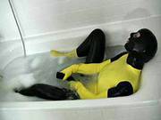 Girl In Yellow Spandex Uniform Has Orgasm In Bathroom