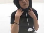 Asian Cutie Spitting On A Glass Table