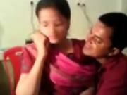 Couple Smooching And Friend Recorded