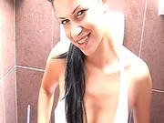 Busty Model Sitting In The Toilet And Penetrating Her Pussy