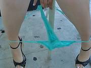 Brunette Kandi Milan In Tiny Skirt Pulls Down Her Thong Panties In Public Place