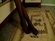 Sexy Brunette In Black Pantyhose Is Showing Her Kitty