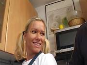 Lovely Blond Heats Up Some Sausage In The Kitchen.