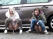 Two Shameless Teen Bitches Piss A Lot Near Luxury Car Of Their Neighbor