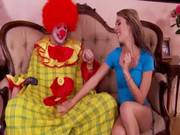 Horny Babe Goes Down On Clown On Couch
