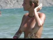 Watch A Naked Chick At The Beach Tan