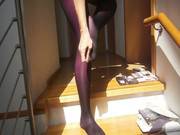 Sexy Woman With Sexy Legs Putting On 8 Layers Of Pantyhose