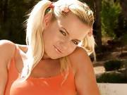 Blonde Teen With Pigtails Plays In The Sun