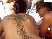 Two Sexy Amateur Chicks Are Sucking Cocks On The Public Beach