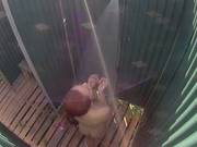 Adorable Girl Is Taking A Bath In A Public Shower On The Beach, In Front Of The Camera