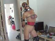 Redhead In Chains Plays With A Big Dildo