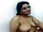 Voracious Dark Haired Woman Demonstrates Her Big Boobs