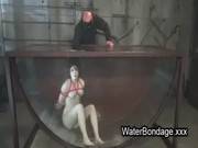 Brunette In Rope Bondage Dive In Water