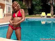 Blonde Babe In A Sexy Red Bikini Showing