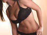Sexy Tanned Brunette In Black Lingerie Fingers Her Shaved Beaver