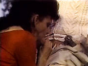 Black Haired Granny Gives Blowjob To Fat Guy On The Balcony