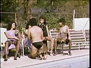Brunettes Sitting Poolside Harass Guy On A Leash