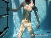 Redhead Mia Stripping Underwater