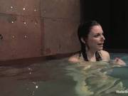 Dark Haired Fetish Babe Is Laced Up Bare Back And Descended Into A Vast Vat