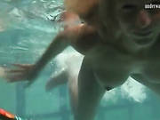 Two Naked Beauties Swim In The Pool