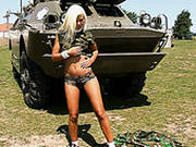 Sweet Teen In Military Costume Is Posing On The Tank