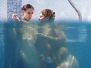 Seductive Brunette Lesbians Tickle Their Snatches Under Water In Pool