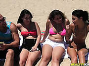Chubby Girls Are Sunbathing On A Beach Wearing Sexy Bikinis
