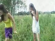 3 Teens Playing Outside In Field