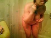 Mature Brunette Milf Takes A Shower And Rubs Her Body