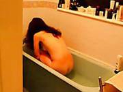 Hot Brunetee Splashing In The Bath.