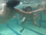 Naked Girls Dive Into The Pool For Underwater Fun