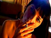 Smoking Brunette Enjoys Warm Oral