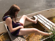 Pale Skinned Girl Anouk Is Playing With Her Clam In The Boat